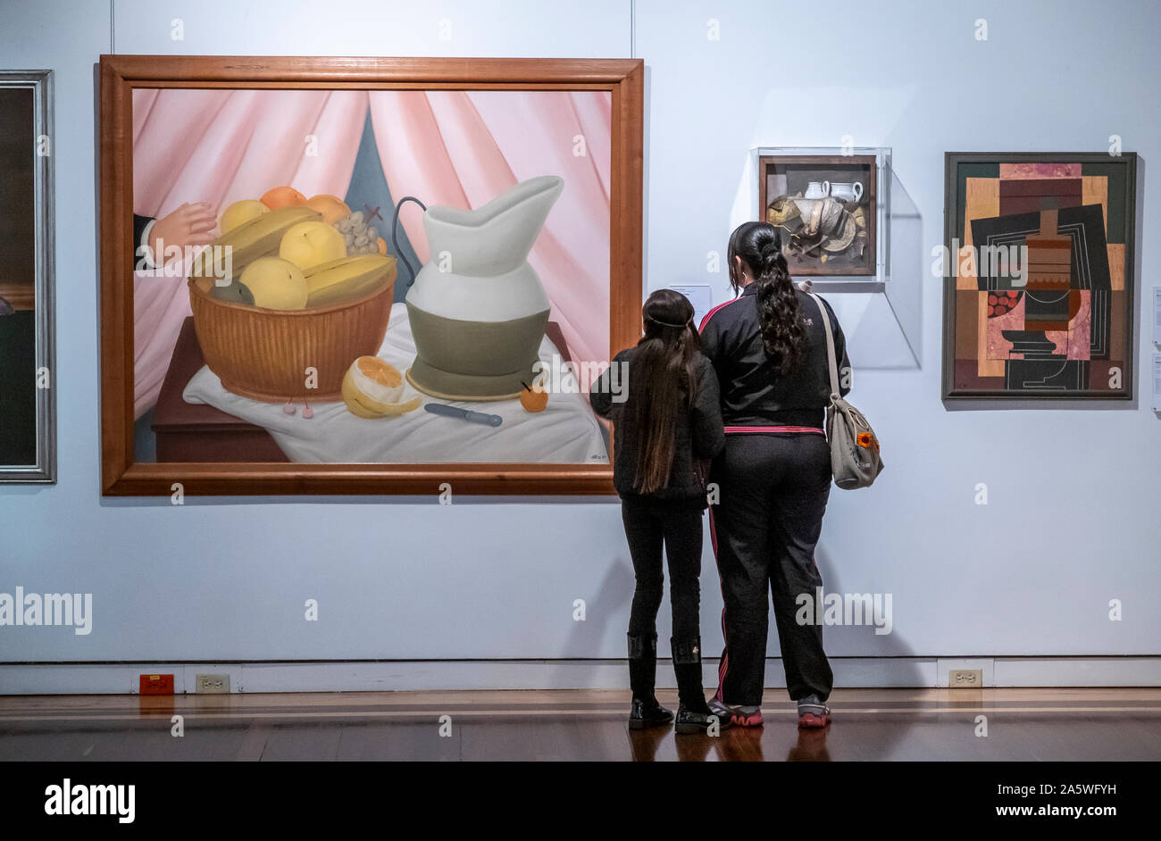 Women observing `Still Life´, by Fernando Botero. Modernities hall, National Museum of Colombia, Bogota, Colombia Stock Photo